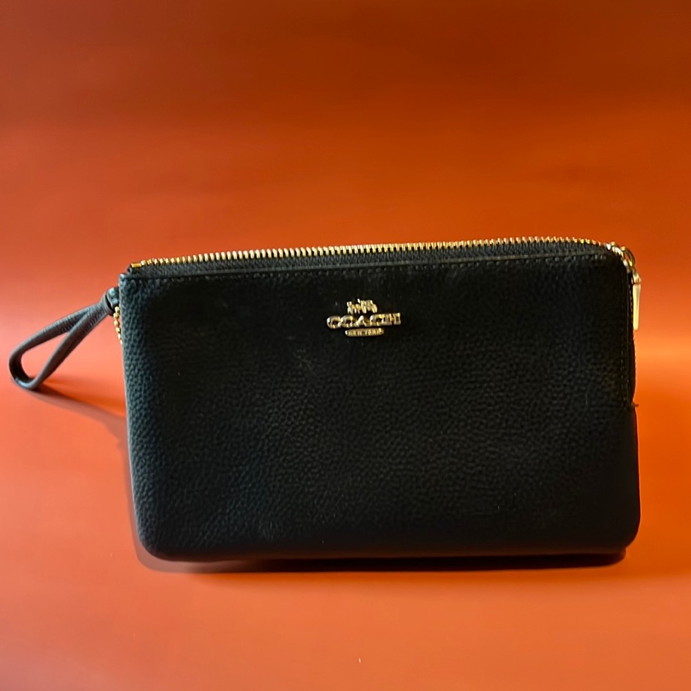 Coach wristlet with 2 compartments.